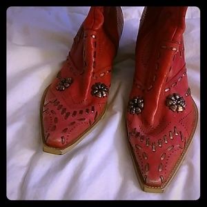 Red western BCBG woman's boots with gold accents.